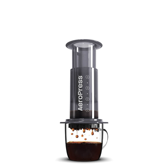 Aerpress portable coffee maker on a cup of coffee