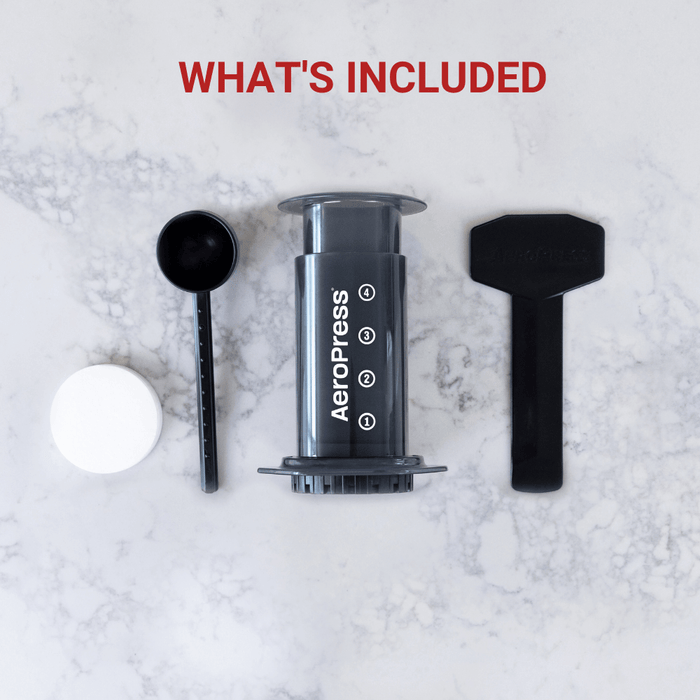 The full aeropress kit including filter paper, scoop, stirrer and Press
