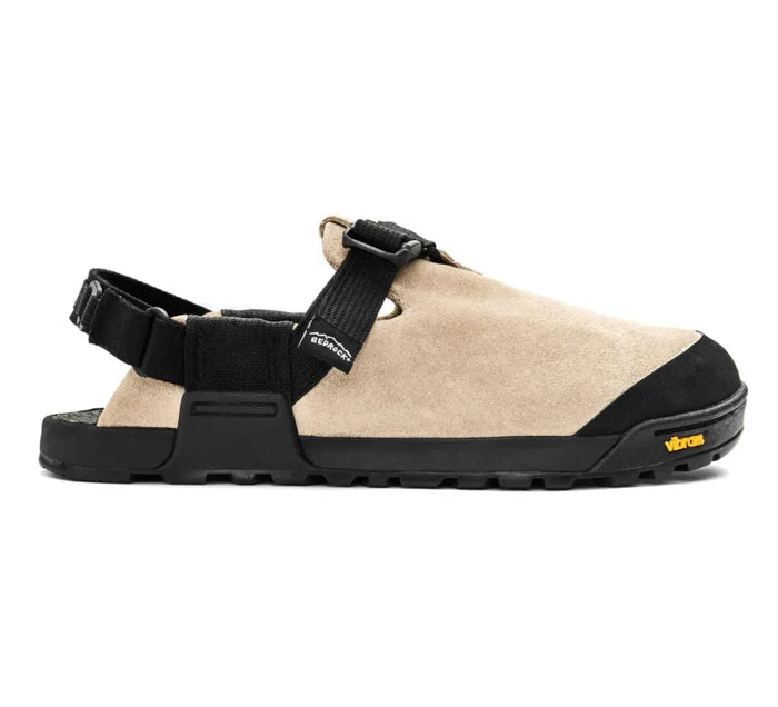 Beige sandal with black straps and sole on a white background
