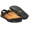 A pair of Bedrock Mountain Clogs with a premium one-piece Nubuck leather upper in brown color, an adjustable strap system, and a black Vibram Megagrip outsole.