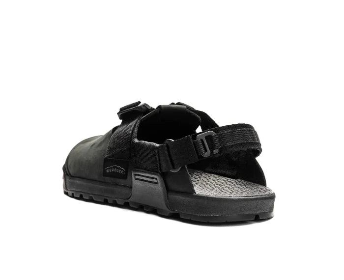 Black sandal with multiple straps on a white background