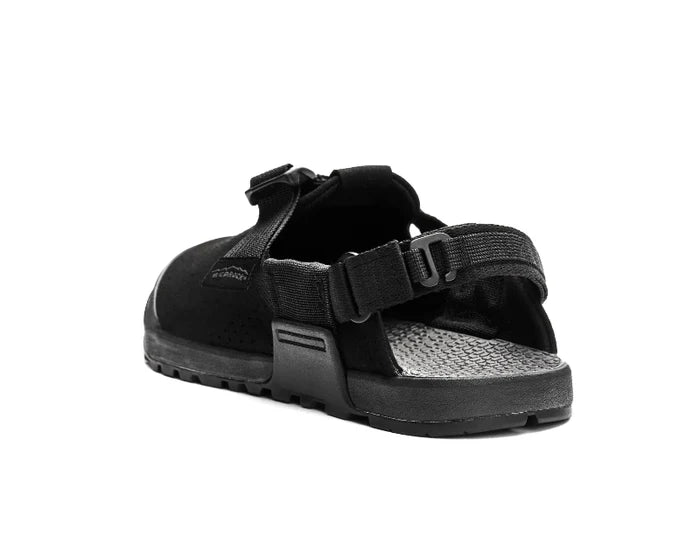 Black sandal with velcro straps on a white background
