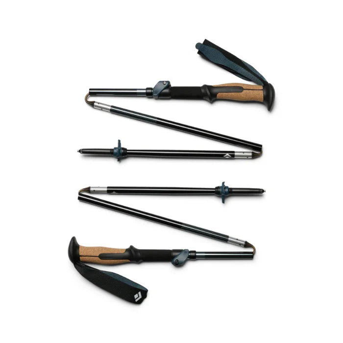 Set of black and brown curling irons on a white background