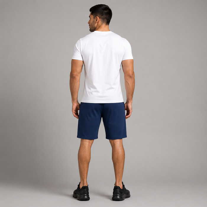 A man wearing a high quality navy blue athletic shorts stretchable material , viewed from behind