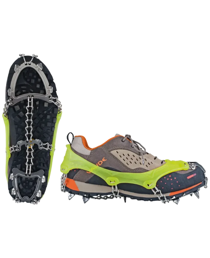 Green and gray shoe with cleats on a white background