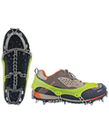 Green and gray shoe with cleats on a white background