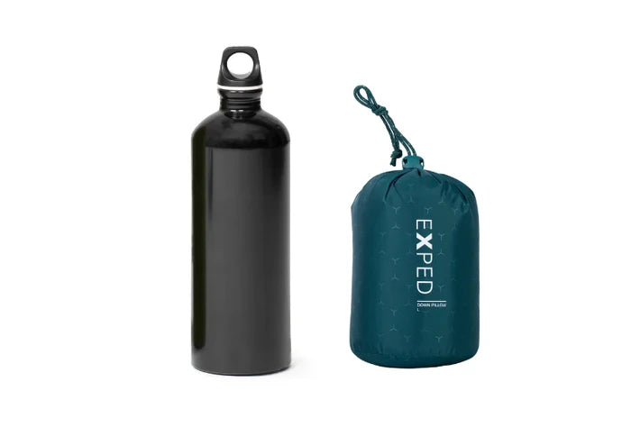 Black water bottle and teal compression sack with 'Exped' branding on a white background