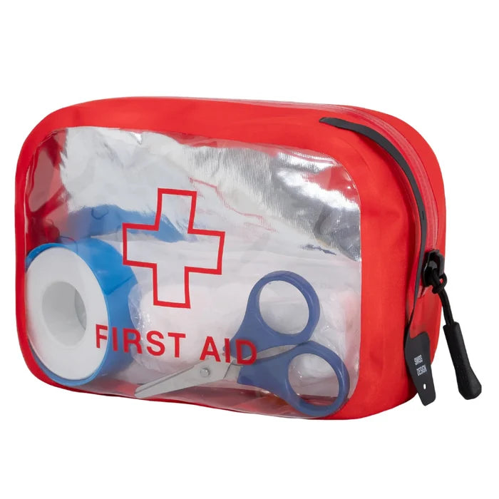Red first aid kit with clear lid showing bandages and scissors on a white background