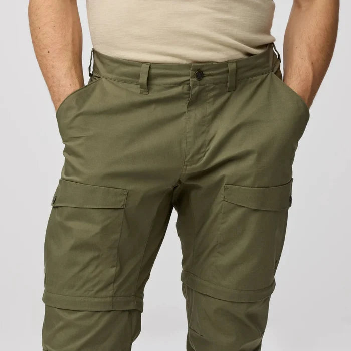 Olive green cargo pants on a plain background