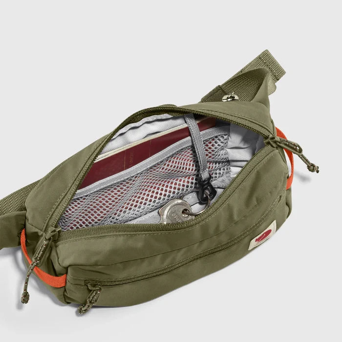 Green bum bag with orange accents on a white background