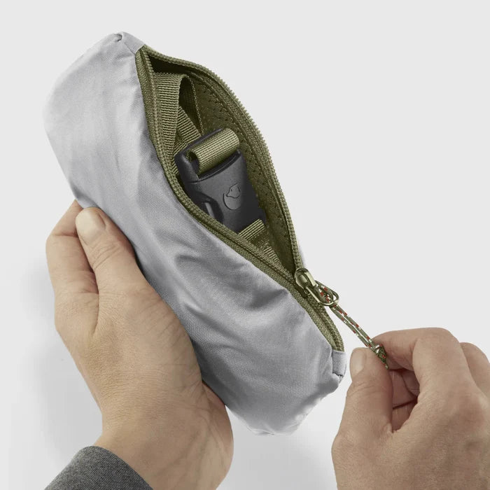 Person turning the bumbag inside out