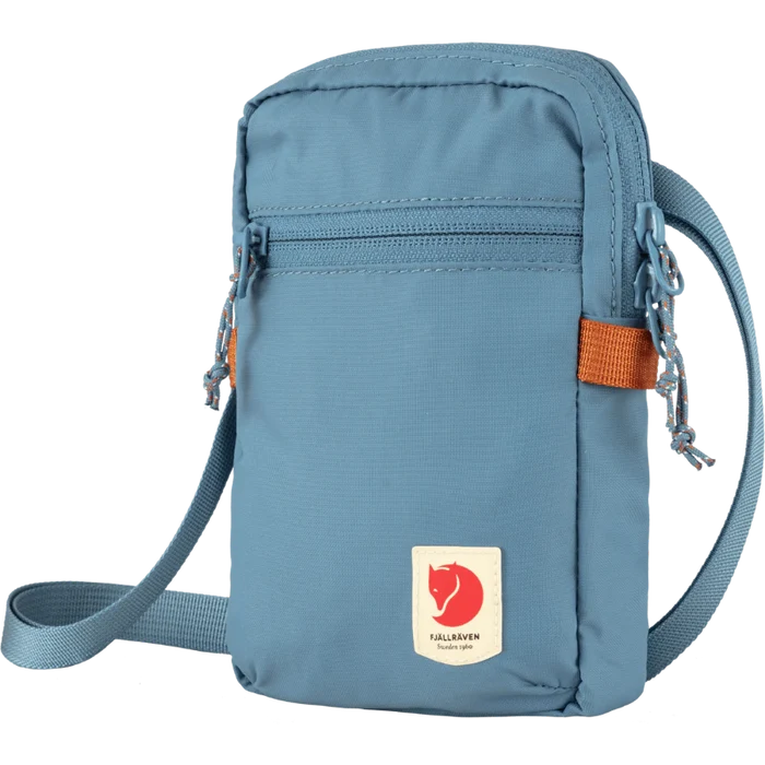 Blue crossbody bag with a visible brand logo on a white background