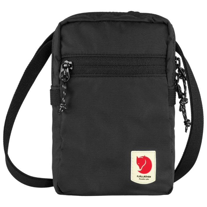 Black crossbody bag with a visible brand logo on a white background