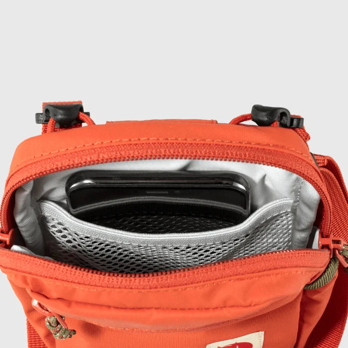 Red bag with a black interior on a gray background