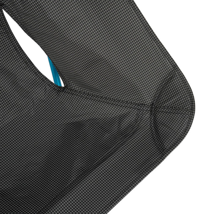 Close-up of a black textured surface with a white border