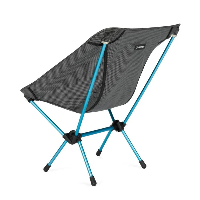 Portable camping chair with blue legs on a white background