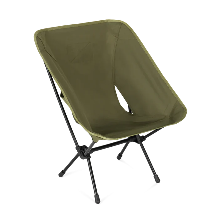 Green camping chair with black legs on a white background