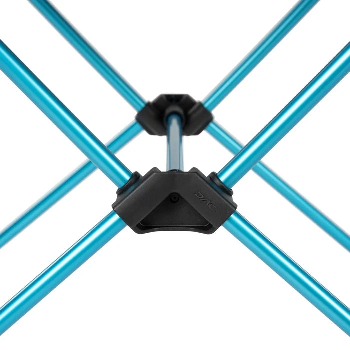 Close-up of blue metal Helinox Camping Table with plastic connectors on a white background
