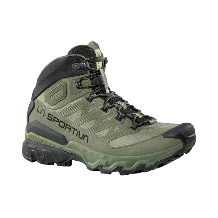 Green hiking boot with black accents on a light gray background
