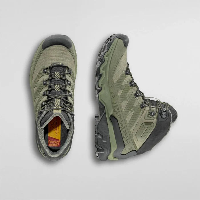 Pair of green hiking boots on a light gray background