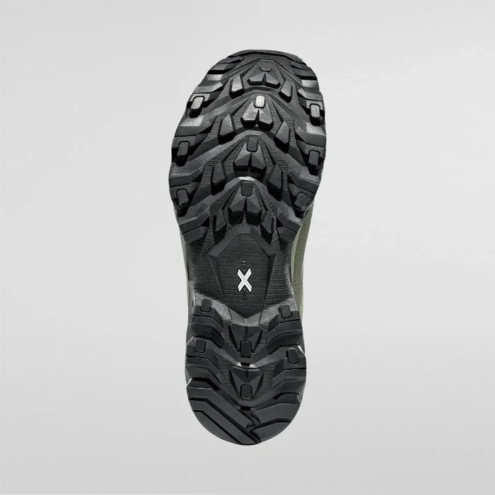Close-up of a hiking shoe sole with tread pattern on a light gray background