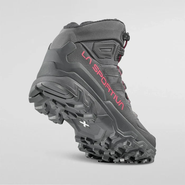 Gray La Sportiva Womens hiking boot with red branding on a light gray background