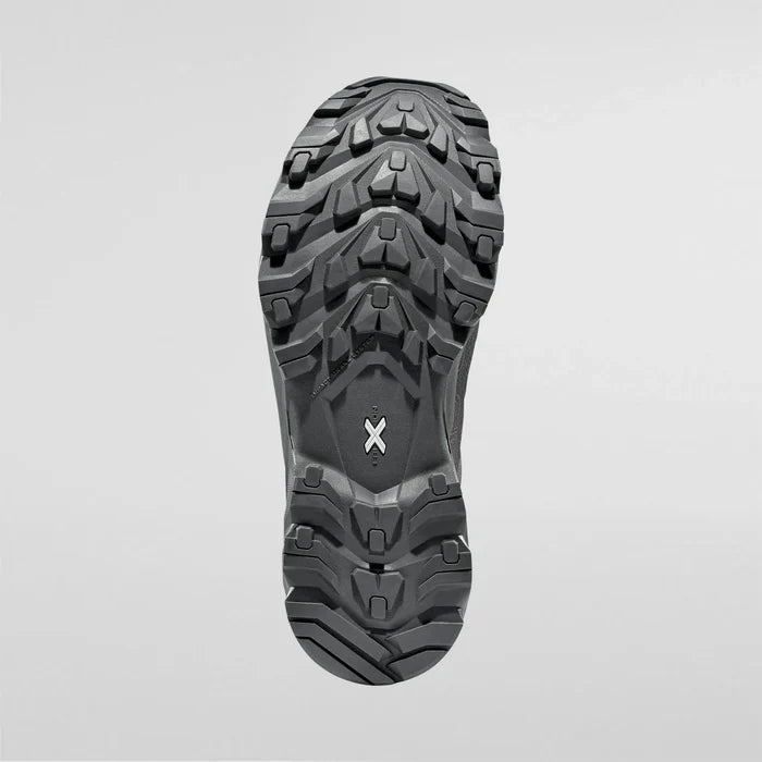 Close-up of a black womens waterproof hiking boot sole on a light gray background