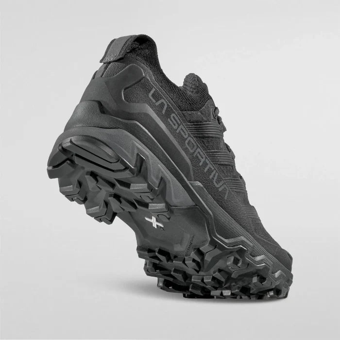 Black hiking shoe with LA Sportiva branding on a light gray background