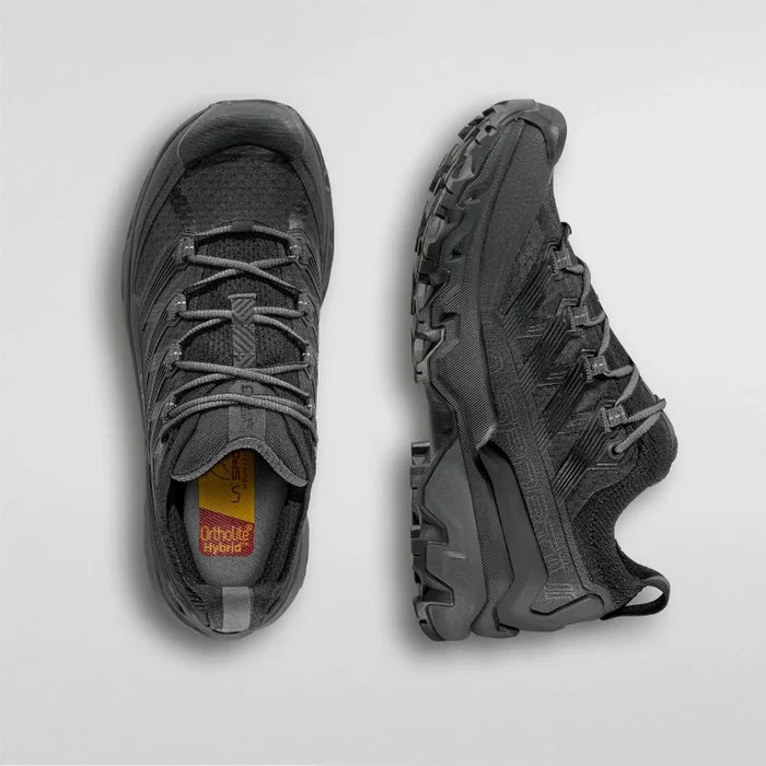 Pair of gray hiking shoes on a light gray background