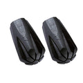 Two black Leki hiking pole tips on a white background
