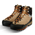Pair of beige and black hiking boots with orange laces on a white background