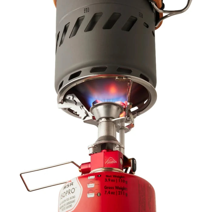 Portable stove with visible flame on a white background