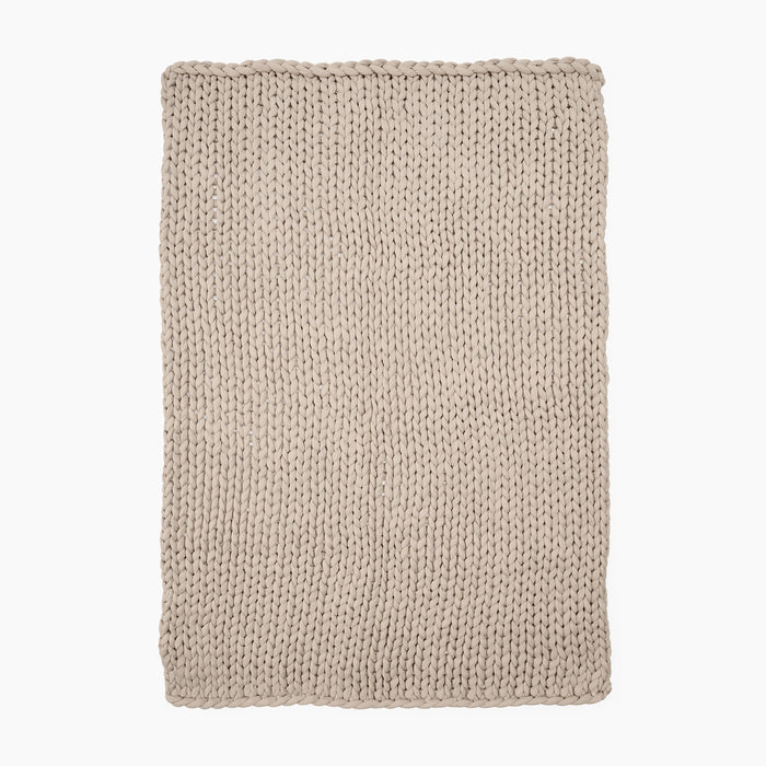 Full Image of beige knitted ocean blanket
