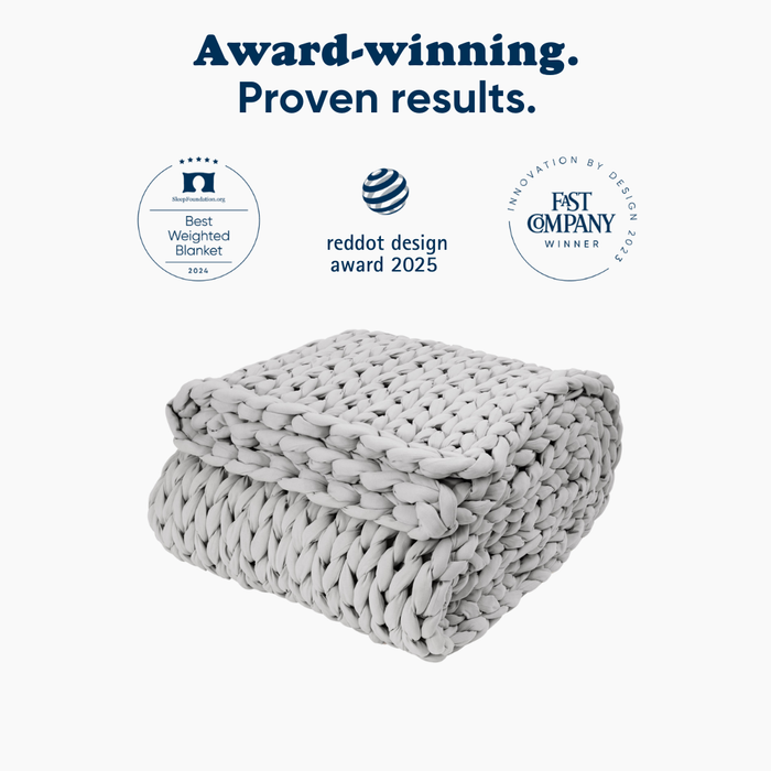 Moonstone Grey knitted ocean napper with three award badges