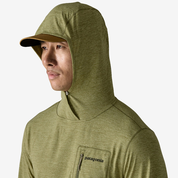Man wearing the Patagonia Men’s Capilene Cool Sun Hoody Fitz Roy Trout with a cap under the hood