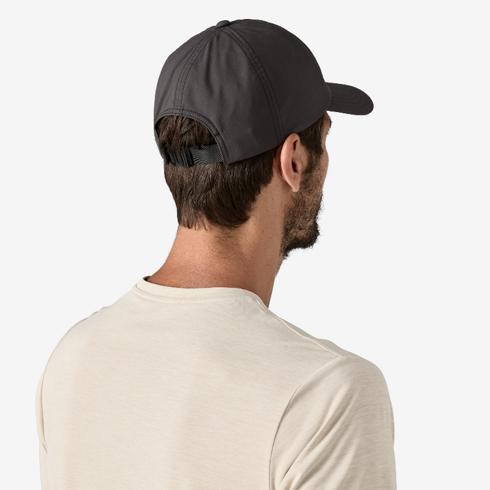 Patagonia Terrebone Cap Black worn by a man in a white shirt showing the back of the cap