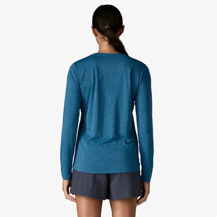 Patagonia womens long sleeved capilene top worn by a woman in navy shorts