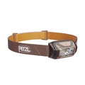 Headlamp with brown strap and visible Petzl logo on a white background