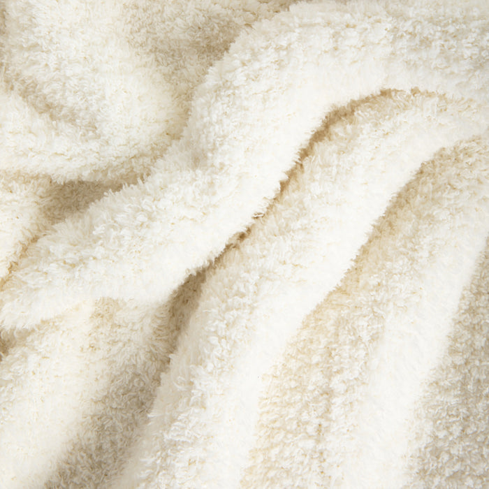 close up image of white plush blanket