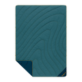 Teal quilted blanket with a brand logo on a white background