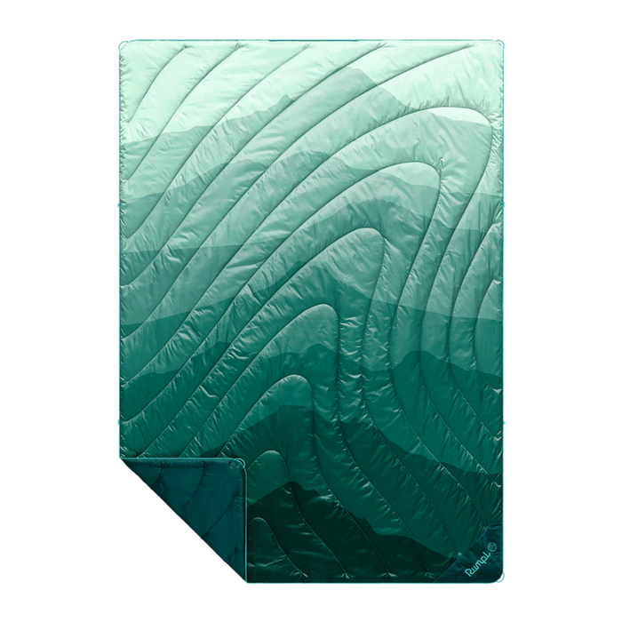 A quilted sleeping pad with a wavy, organic pattern in a gradient of mint green to deep teal, shown on a plain white background with one corner folded over.