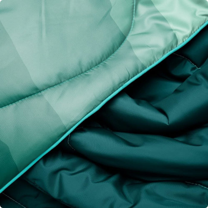 Close-up of teal quilted fabric with a soft texture