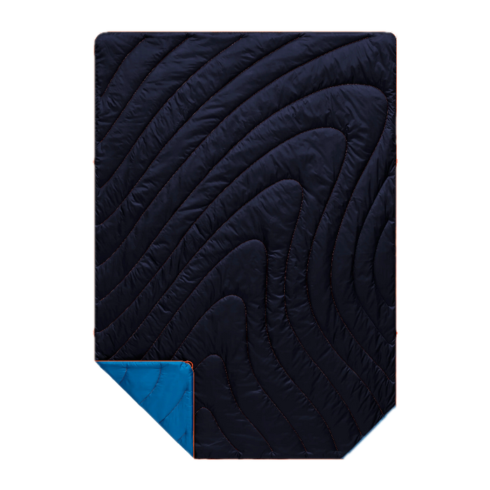 A dark navy quilted sleeping pad with a wavy, flowing pattern of stitching, shown with a corner folded over to reveal a bright blue backing on a solid white background.
