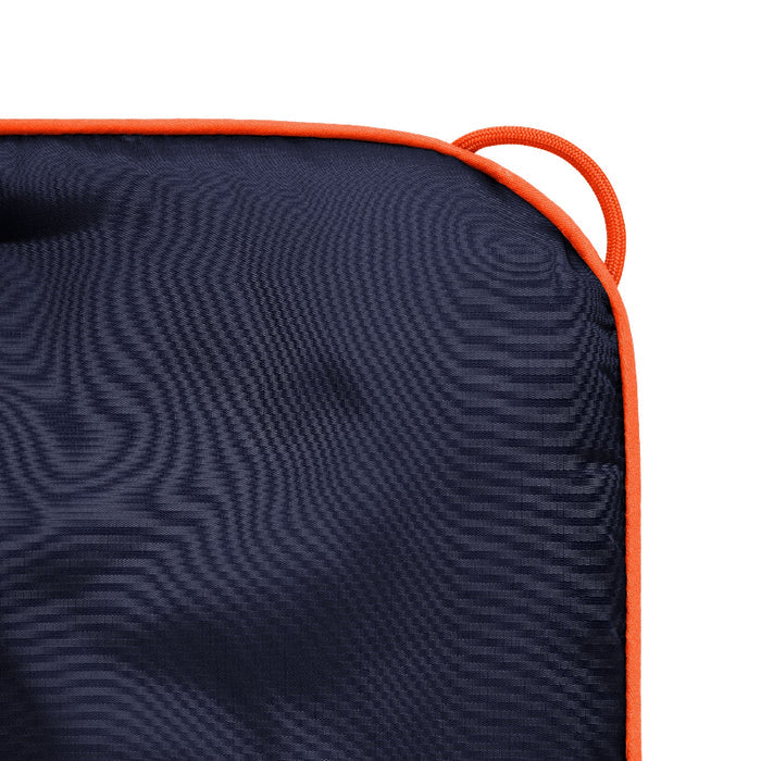 Navy cushion with orange trim on a white background