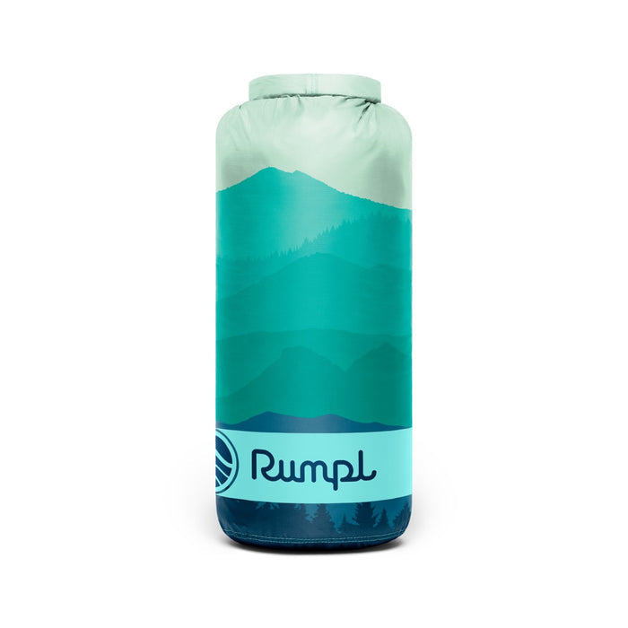 Teal and light blue Rumpl Travel Blanket in a bag with mountain design on a white background