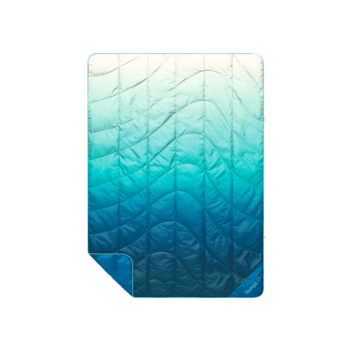 Gradient blue travel blanket on a white background