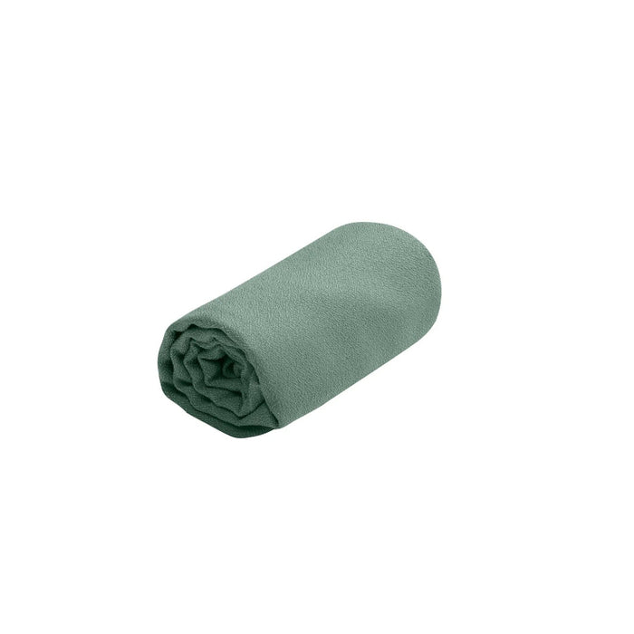 Rolled-up green towel on a white background