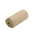 Rolled-up beige towel on a white background
