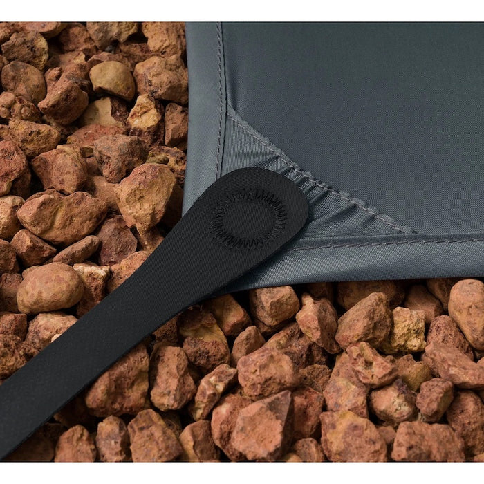A close up photo of a telos  tent footprint attachment system