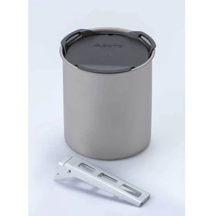 Metal camping pot with a lid on a light gray background